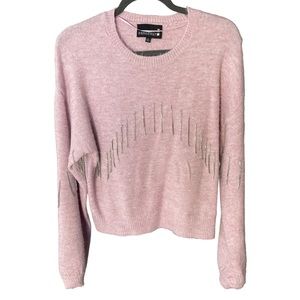 Soft purple sweater with dangling gems on the font and arms